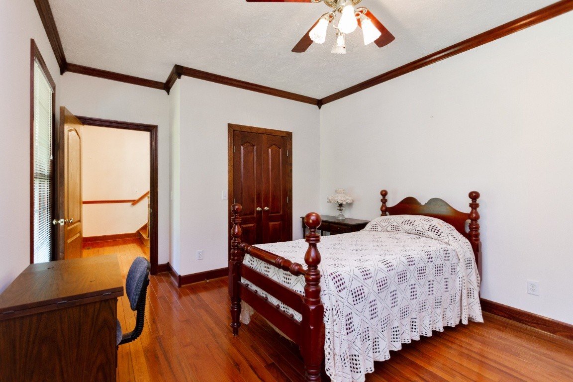 1930 Alsup Mill Road Lascassas, TN 37085 - Photo 22 of 50 a bedroom with a bed and wooden floor