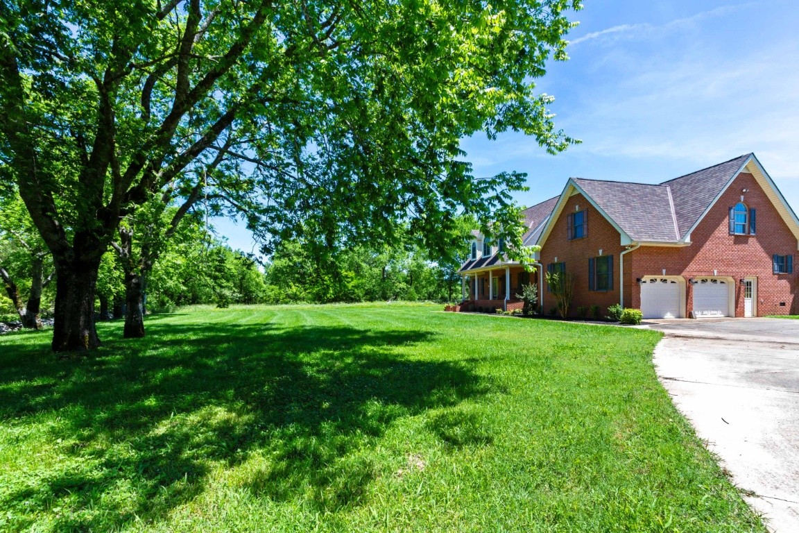 1930 Alsup Mill Road Lascassas, TN 37085 - Photo 3 of 50 a front view of house with yard and green space