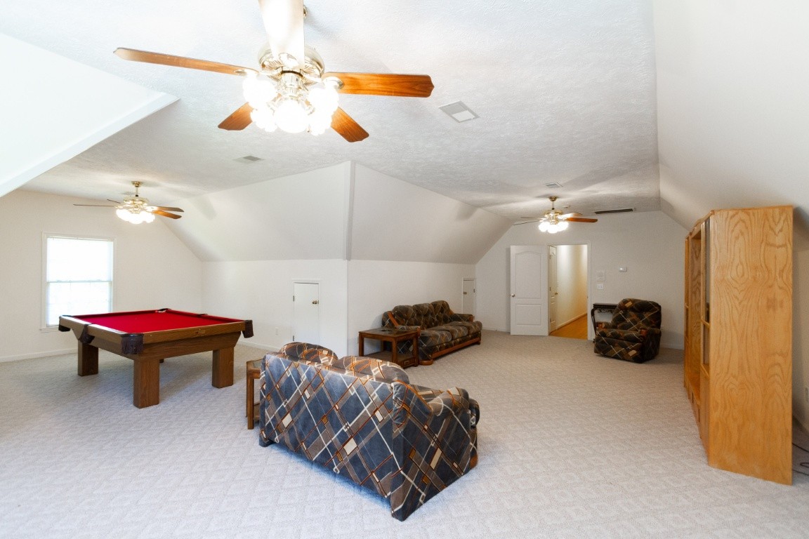 1930 Alsup Mill Road Lascassas, TN 37085 - Photo 34 of 50 a room with a bed and a chandelier