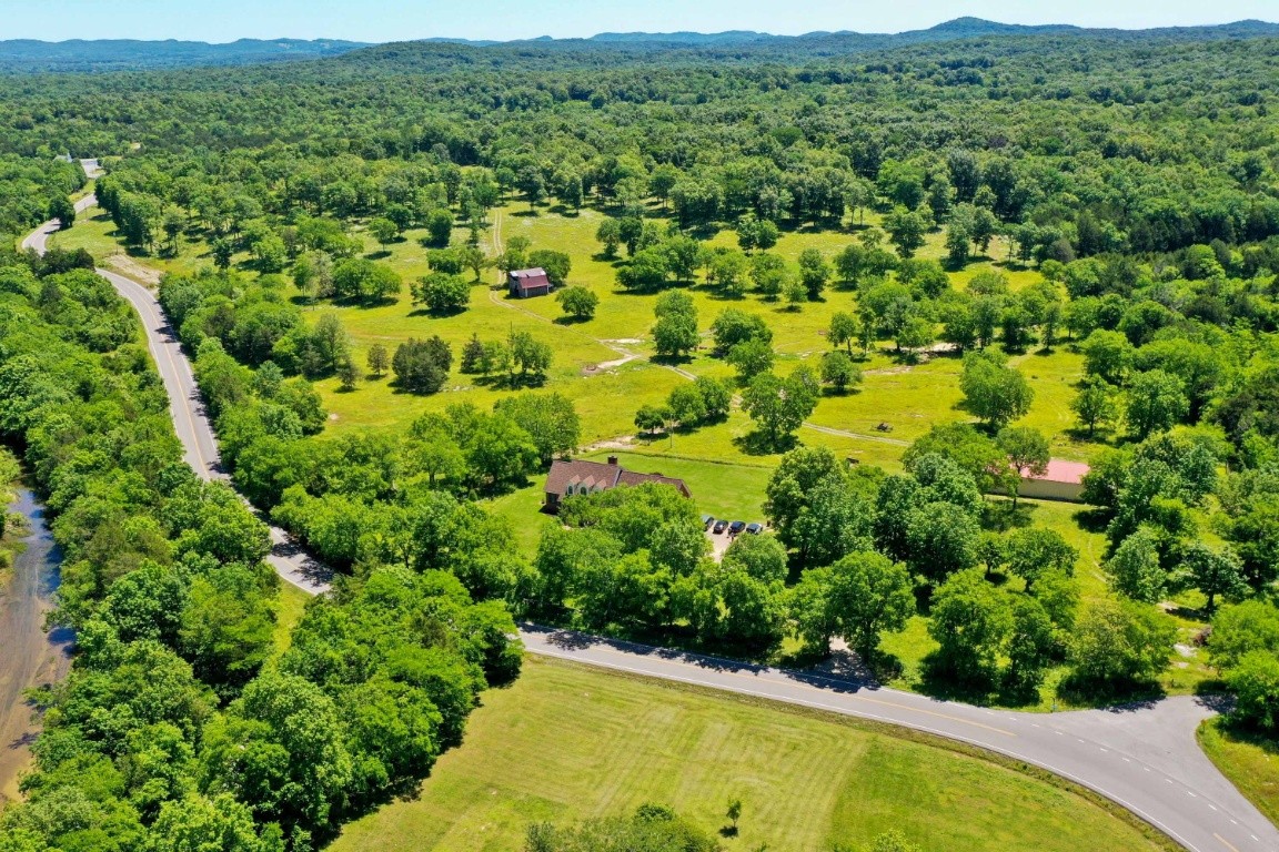 1930 Alsup Mill Road Lascassas, TN 37085 - Photo 42 of 50 a view of a lush green field with lots of bushes