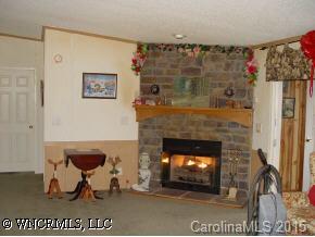 619 Short Ridge Lane Clyde, NC 28721 - Photo 4 of 9 a living room with a fireplace
