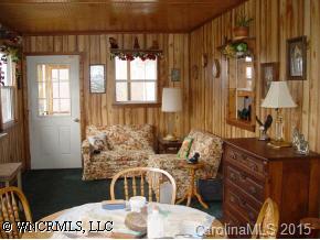 619 Short Ridge Lane Clyde, NC 28721 - Photo 6 of 9 a view of a dining room with furniture and chandelier