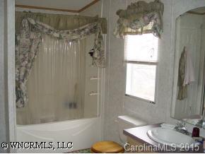 619 Short Ridge Lane Clyde, NC 28721 - Photo 8 of 9 a bathroom with a sink toilet and shower