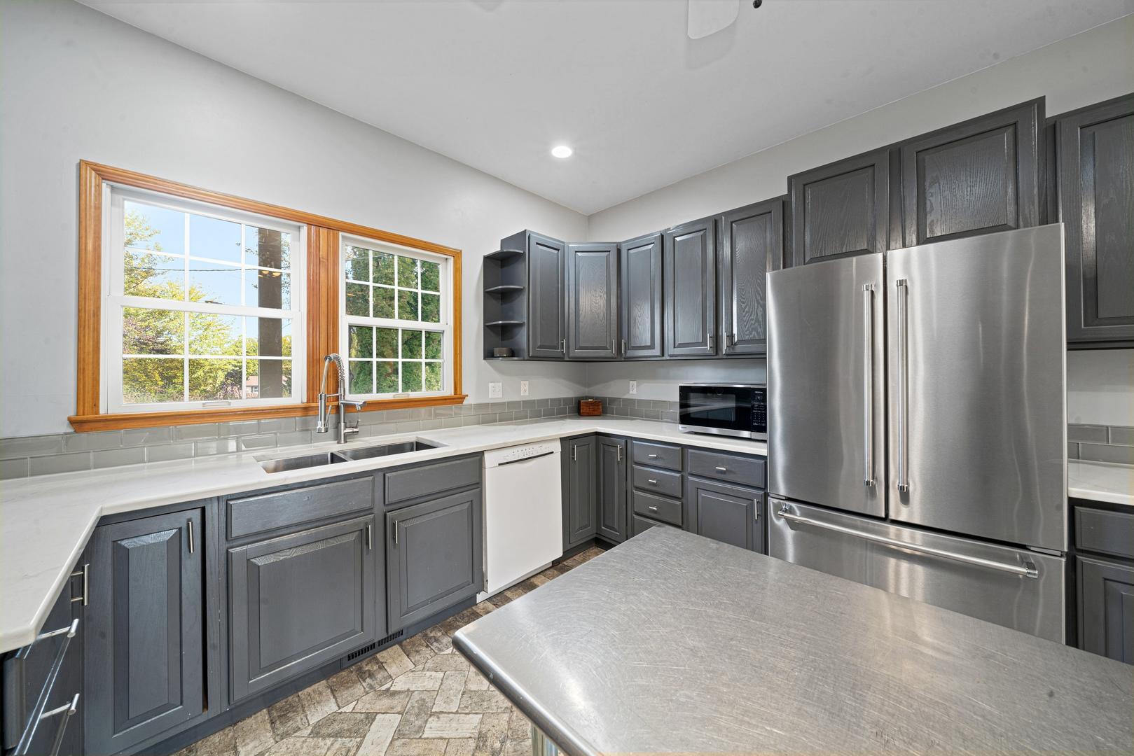 43W140 Campton Hills Road Elburn, IL 60119 - Photo 13 of 54 a kitchen with a refrigerator sink and cabinets