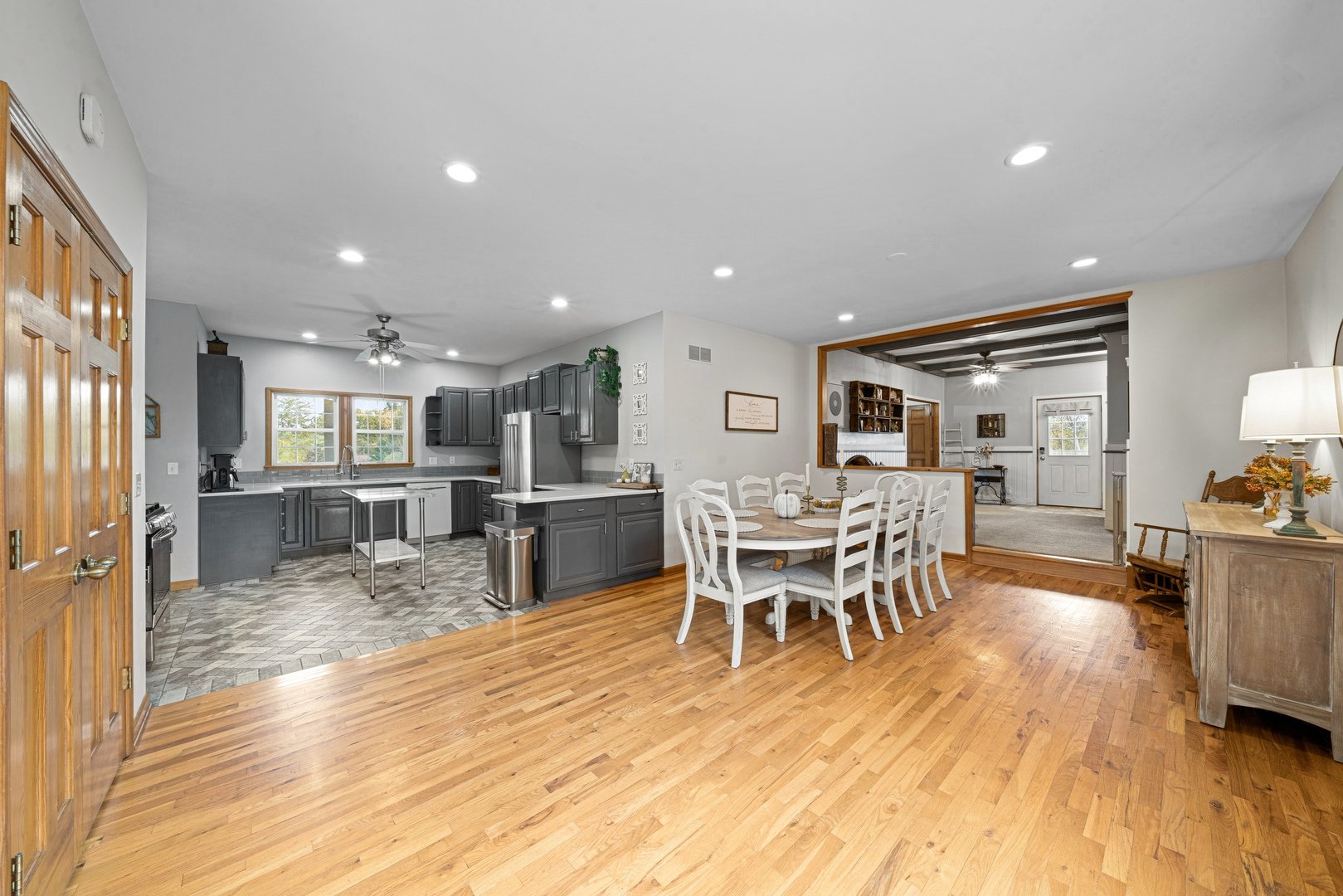 43W140 Campton Hills Road Elburn, IL 60119 - Photo 14 of 54 a dining room with furniture and wooden floor