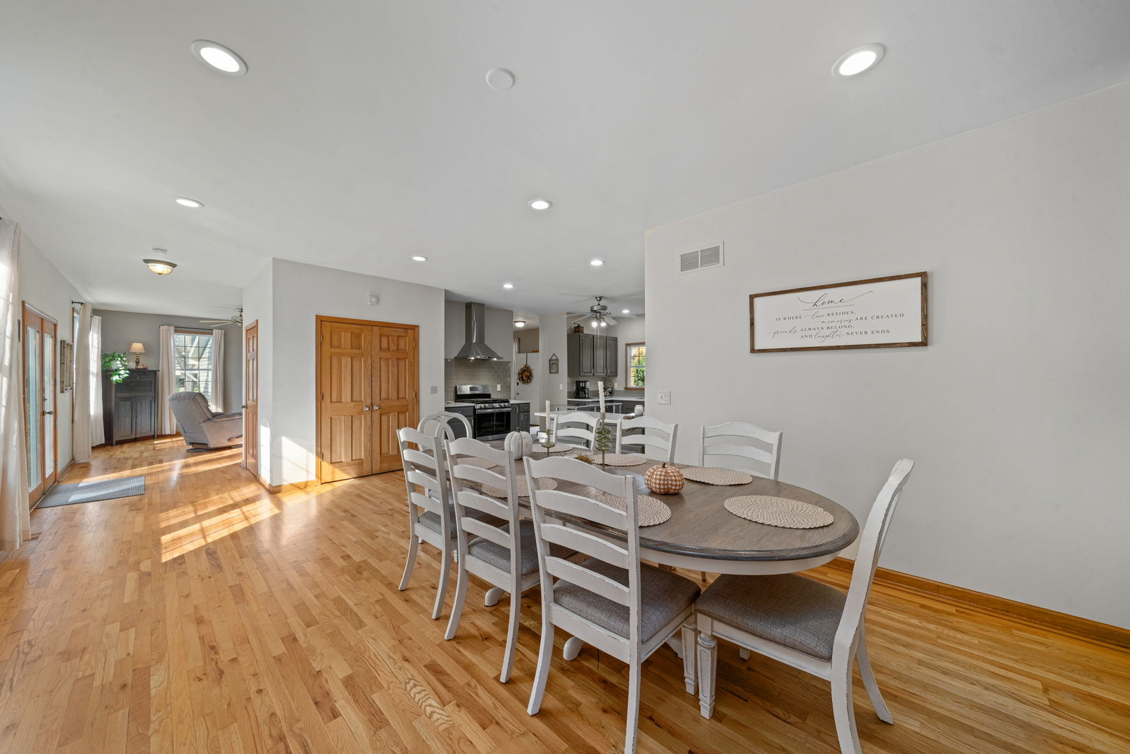 43W140 Campton Hills Road Elburn, IL 60119 - Photo 16 of 54 a view of a dining room with furniture and wooden floor