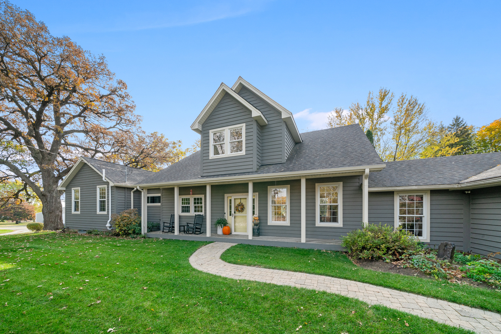 43W140 Campton Hills Road Elburn, IL 60119 - Photo 2 of 54 a front view of a house with a yard and porch