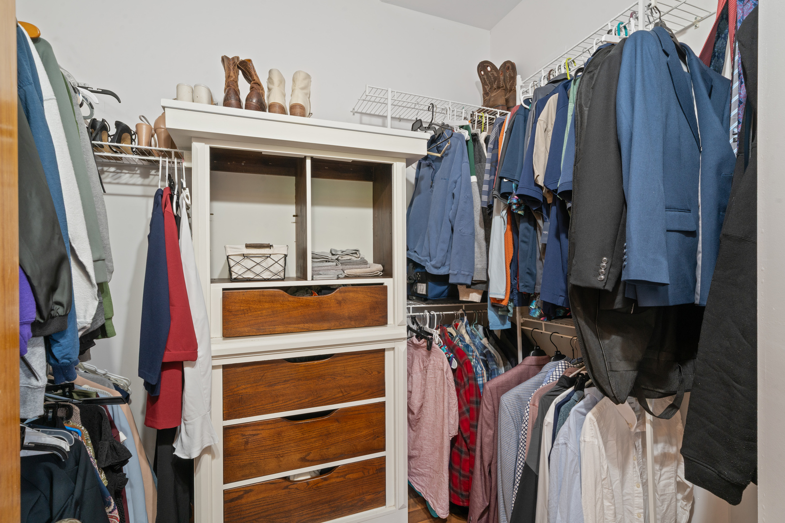 43W140 Campton Hills Road Elburn, IL 60119 - Photo 26 of 54 a view of walk in closet with clothes and shoes