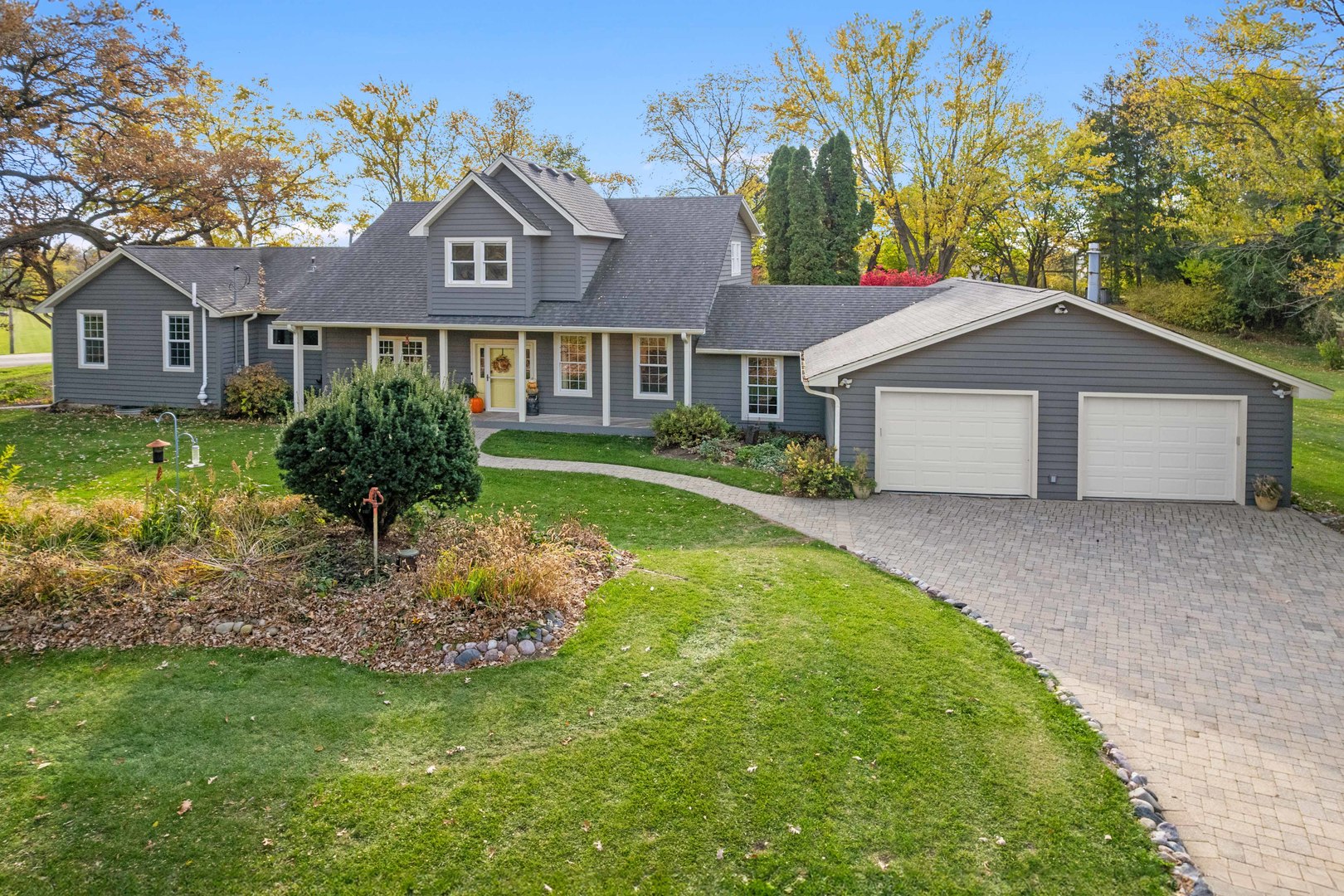 43W140 Campton Hills Road Elburn, IL 60119 - Photo 3 of 54 a front view of a house with a garden
