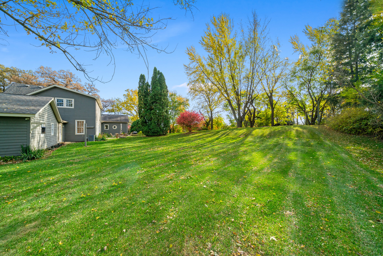 43W140 Campton Hills Road Elburn, IL 60119 - Photo 43 of 54 a view of a house with a big yard