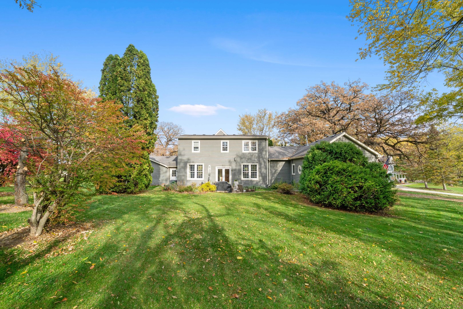 43W140 Campton Hills Road Elburn, IL 60119 - Photo 53 of 54 a view of a garden with a building in the background