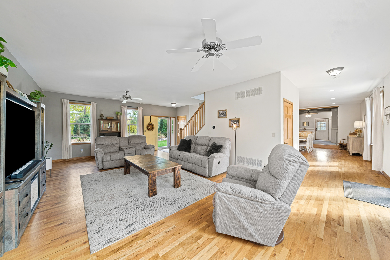 43W140 Campton Hills Road Elburn, IL 60119 - Photo 7 of 54 a living room with furniture and a flat screen tv