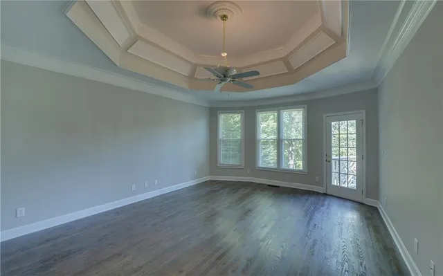 a white bath tub sitting in a bathroom next to a window