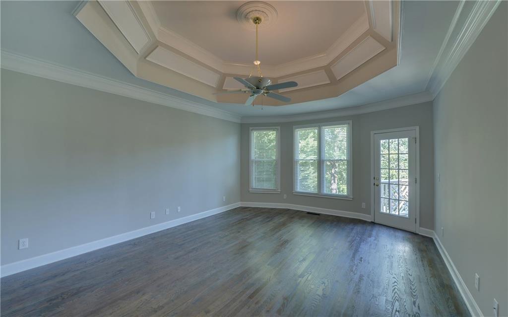 2092 Bakers Mill Road Dacula, GA 30019 - Photo 17 of 65 a view of livingroom with window wooden floor and chandelier