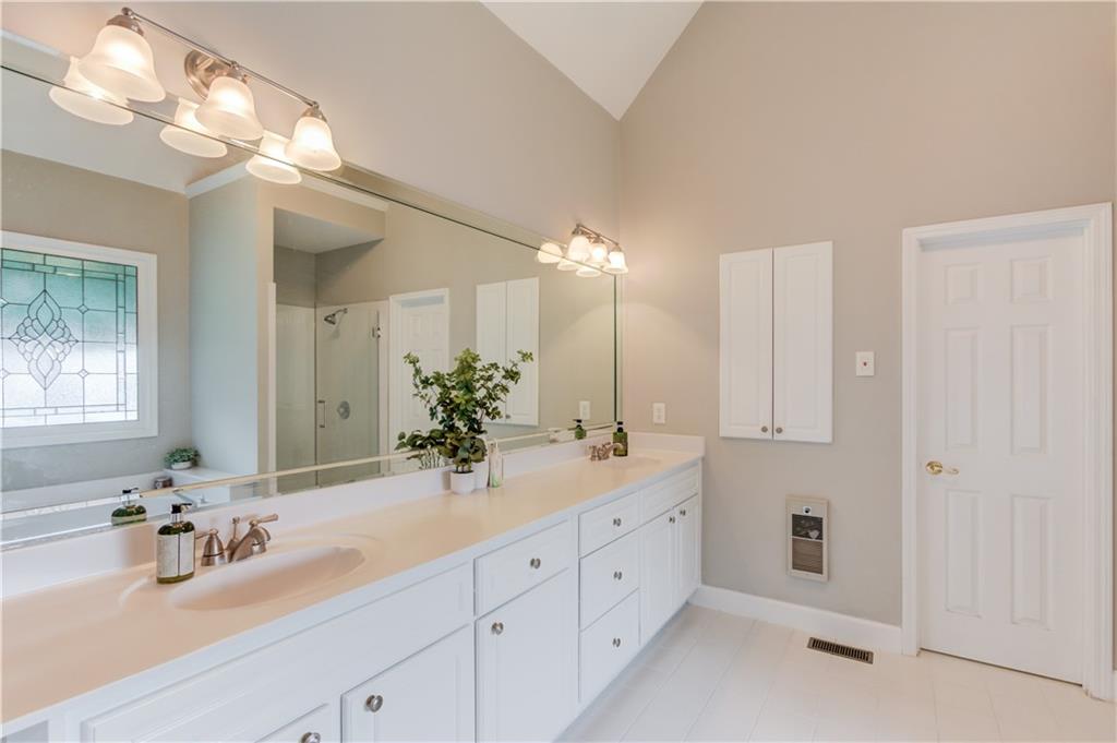 2092 Bakers Mill Road Dacula, GA 30019 - Photo 20 of 65 a bathroom with a double vanity sink mirror and double