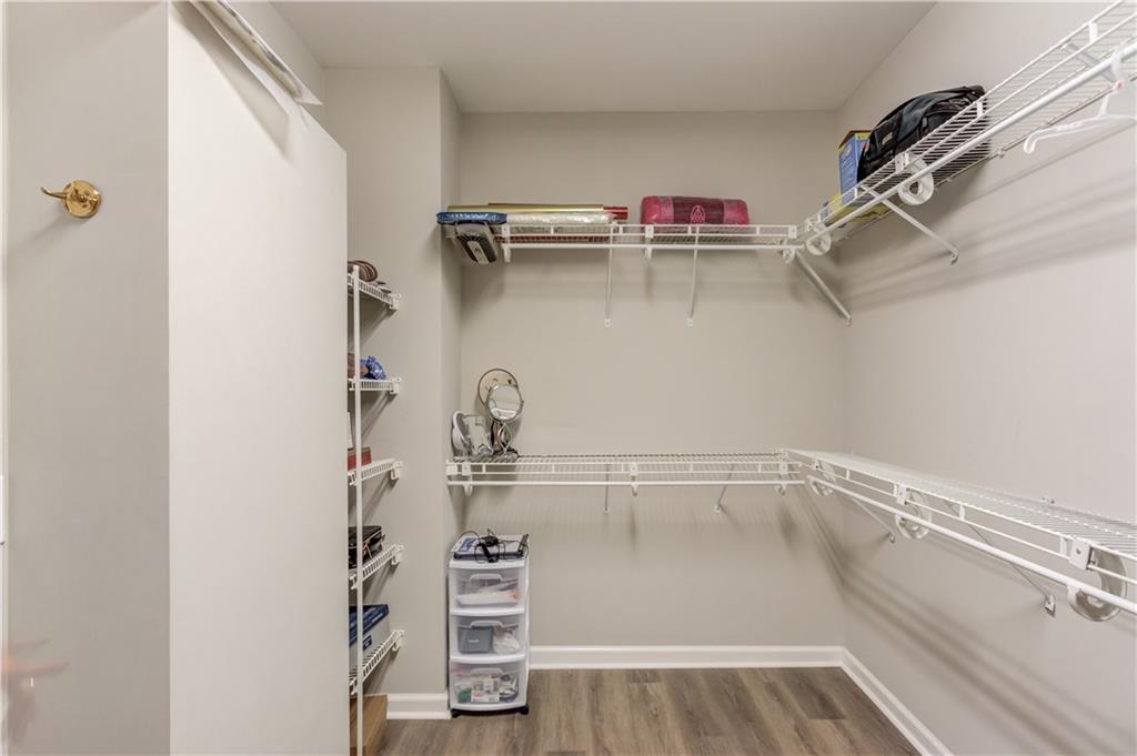 2092 Bakers Mill Road Dacula, GA 30019 - Photo 21 of 65 a view of walk in closet with empty racks