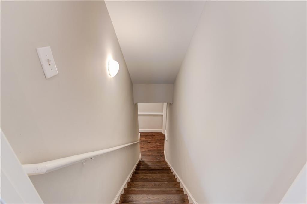 2092 Bakers Mill Road Dacula, GA 30019 - Photo 28 of 65 a view of a hallway with wooden floor