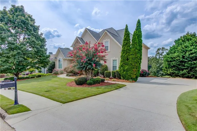 a front view of a house with garden