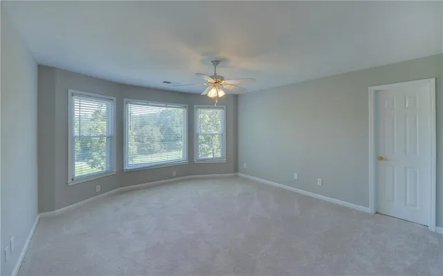 a view of a balcony with wooden floor
