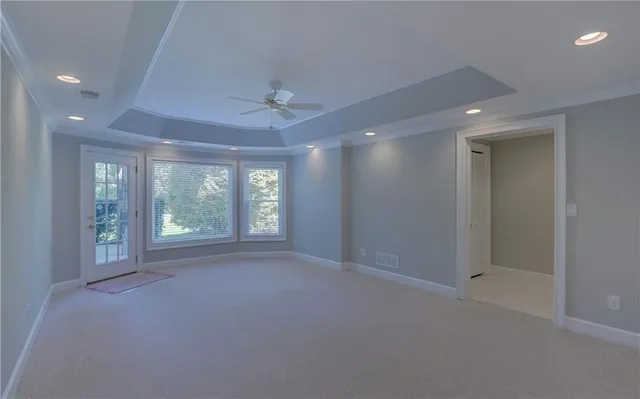 a view of backyard with green space and stairs