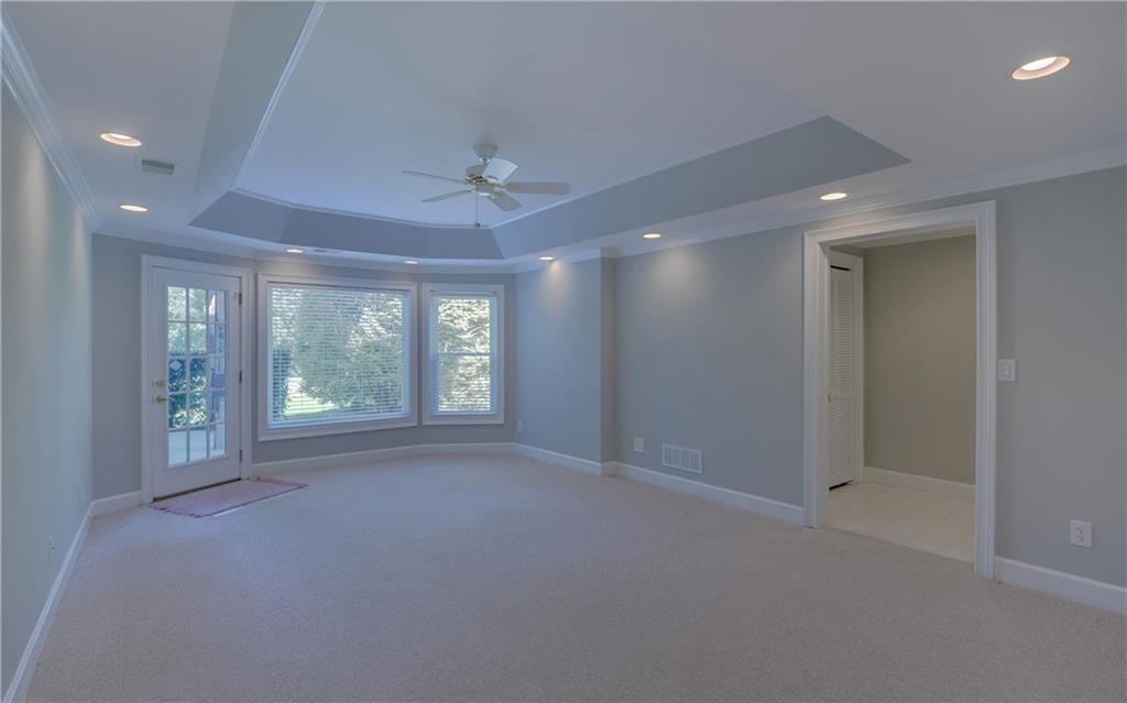 2092 Bakers Mill Road Dacula, GA 30019 - Photo 33 of 65 a view of a livingroom with a ceiling fan and window