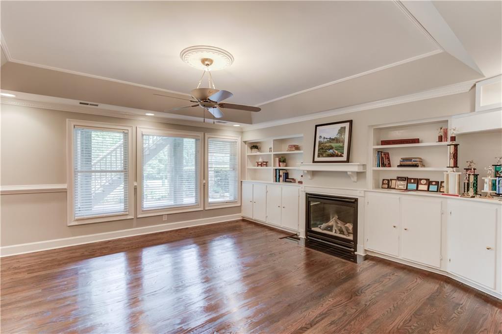 2092 Bakers Mill Road Dacula, GA 30019 - Photo 34 of 65 a view of a livingroom with a fireplace wooden floor and window
