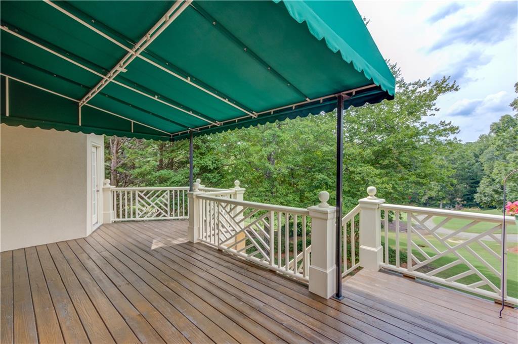 2092 Bakers Mill Road Dacula, GA 30019 - Photo 35 of 65 a view of a balcony with wooden floor