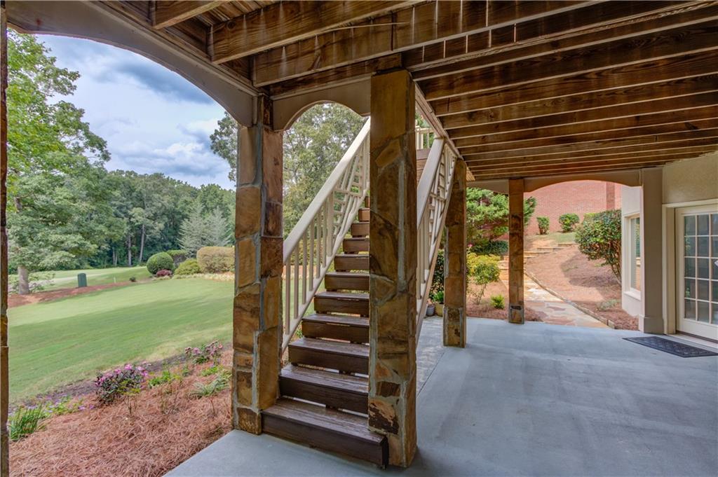2092 Bakers Mill Road Dacula, GA 30019 - Photo 38 of 65 a view of backyard with green space and stairs