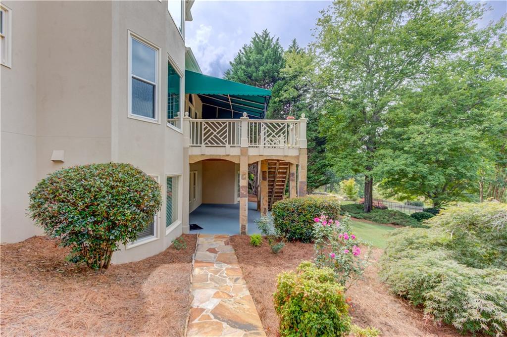 2092 Bakers Mill Road Dacula, GA 30019 - Photo 40 of 65 a front view of a house with garden
