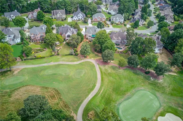 a view of a house with a yard from a fountain