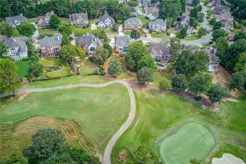 2092 Bakers Mill Road Dacula, GA 30019 - Photo 48 of 65 an aerial view of residential houses with outdoor space and trees