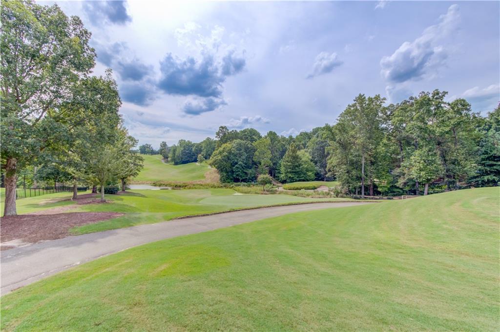 2092 Bakers Mill Road Dacula, GA 30019 - Photo 49 of 65 a view of a playground and basketball court
