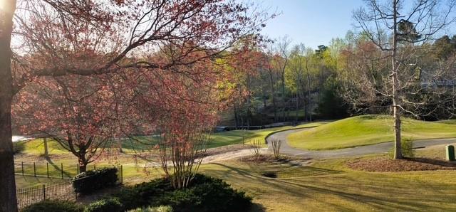 2092 Bakers Mill Road Dacula, GA 30019 - Photo 52 of 65 a view of a swimming pool with an outdoor seating and yard