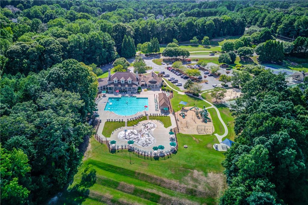 2092 Bakers Mill Road Dacula, GA 30019 - Photo 61 of 65 a view of a table and chairs in the garden