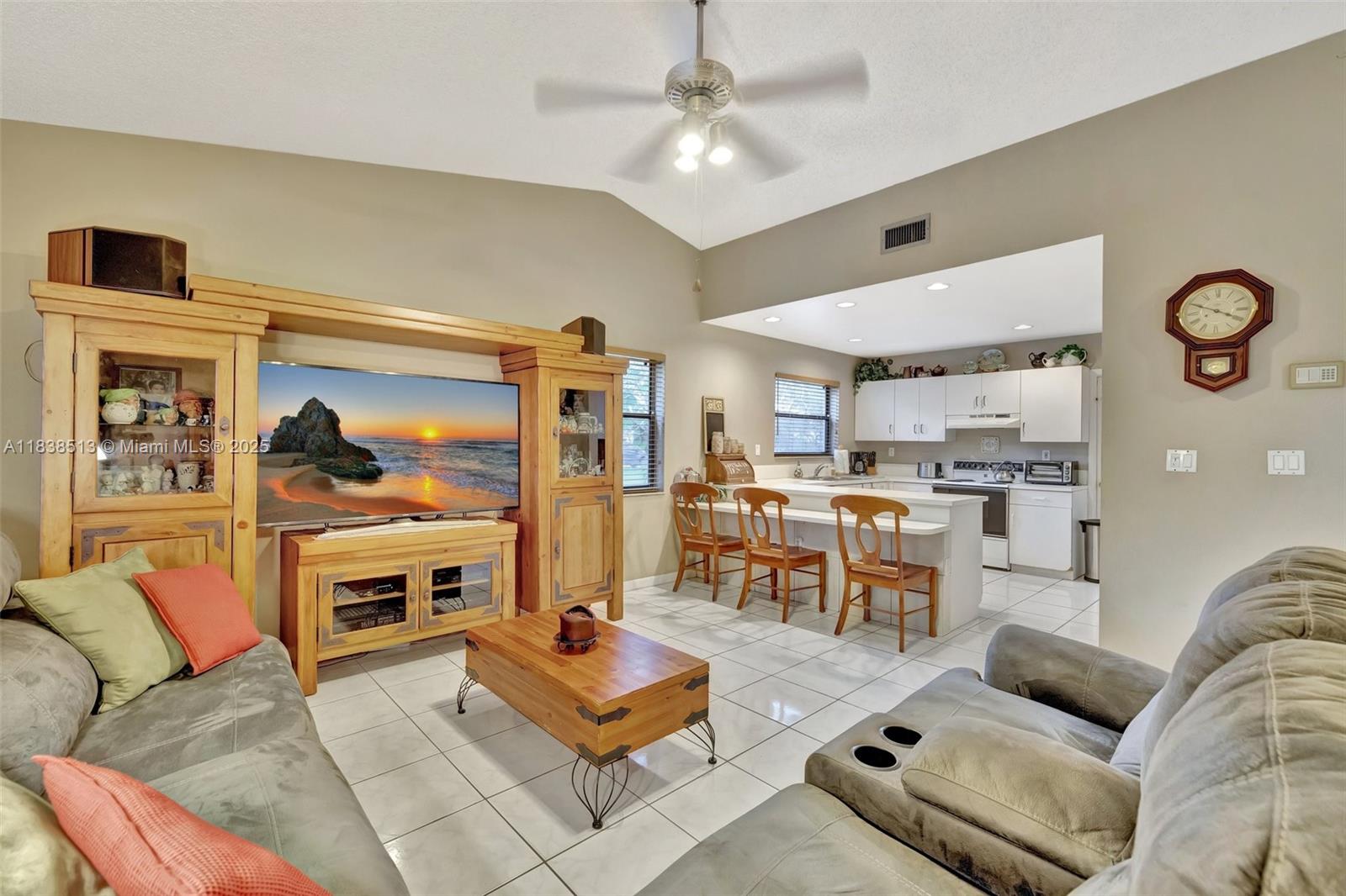 5911 Epsom Court Davie, FL 33331 - Photo 11 of 38 a living room with furniture kitchen view and a window