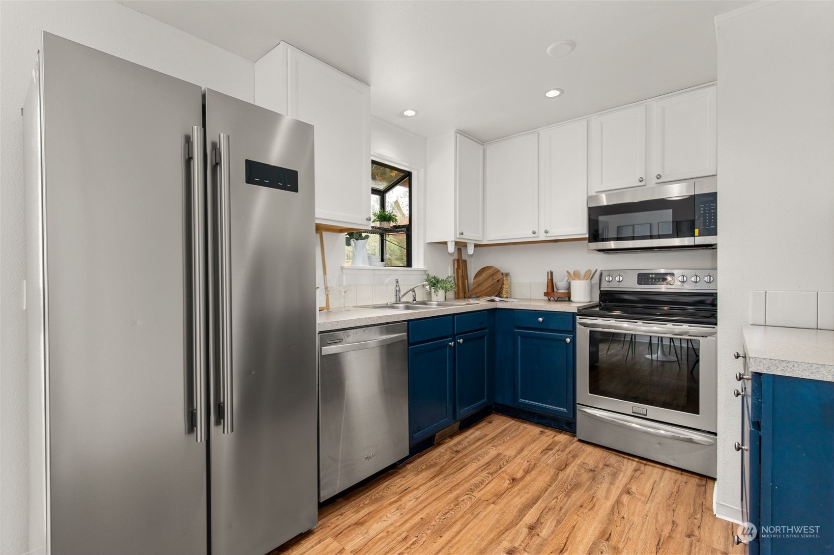 22700 1st Place West Bothell, WA 98021 - Photo 12 of 32 a kitchen with stainless steel appliances granite countertop a refrigerator stove and sink