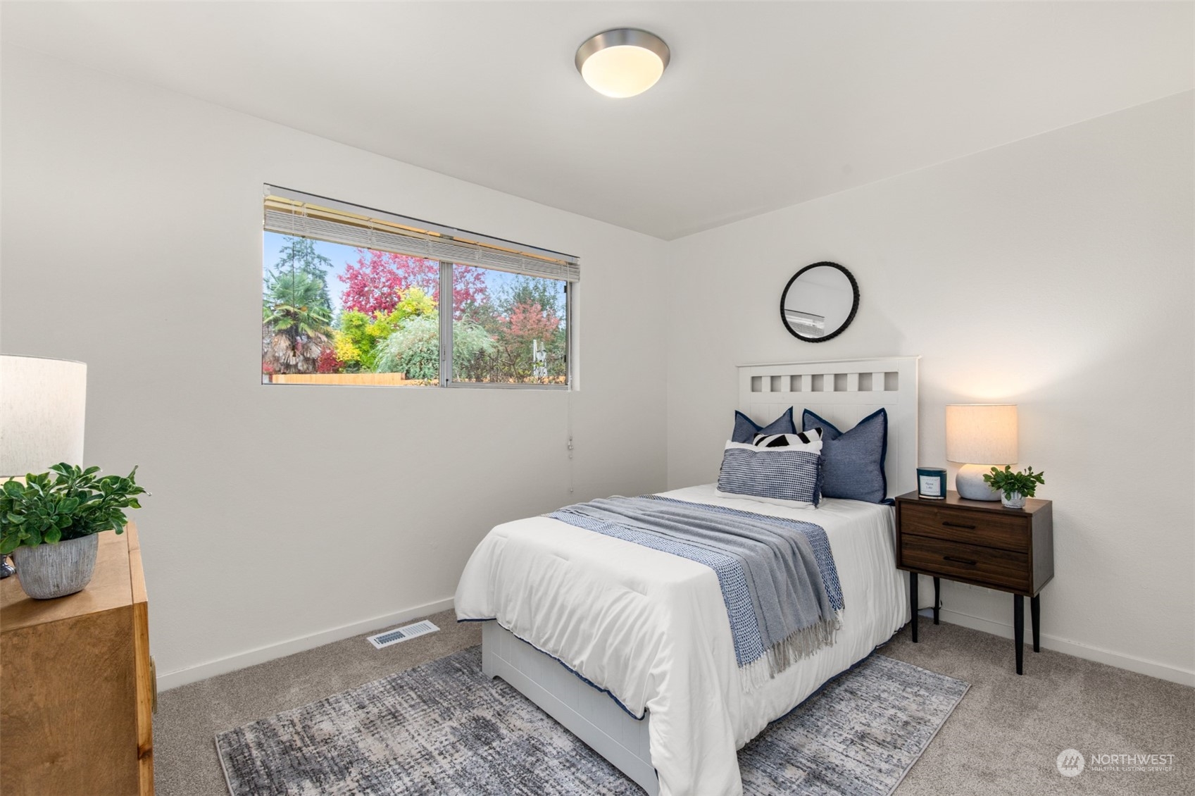 22700 1st Place West Bothell, WA 98021 - Photo 18 of 32 a bedroom with a bed and a painting on the wall