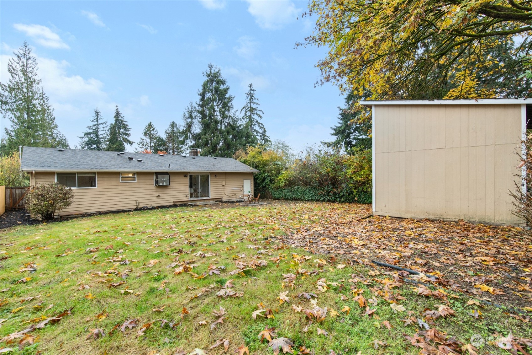 22700 1st Place West Bothell, WA 98021 - Photo 27 of 32 a house with trees in the background