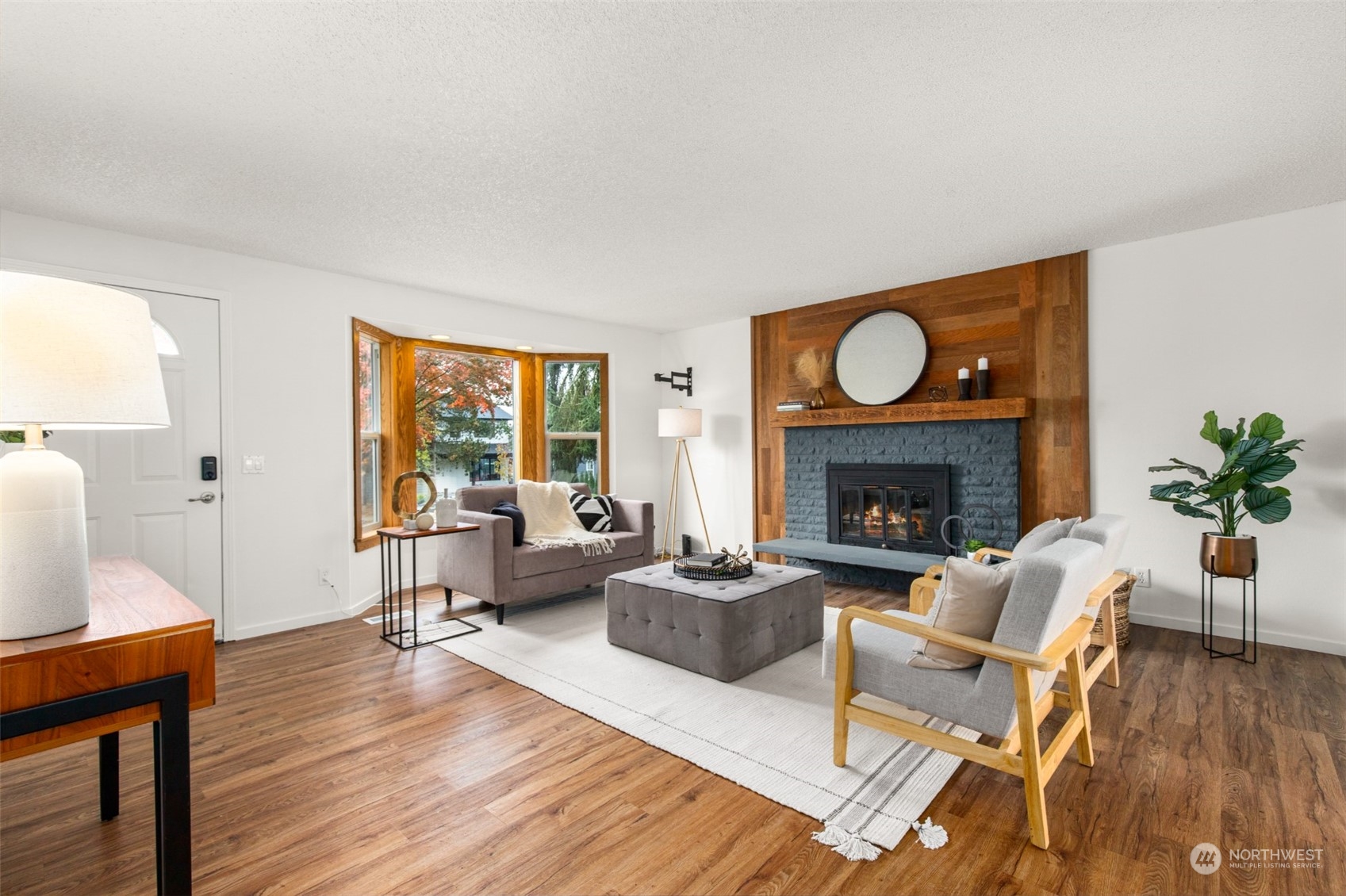 22700 1st Place West Bothell, WA 98021 - Photo 5 of 32 a living room with furniture and a fireplace