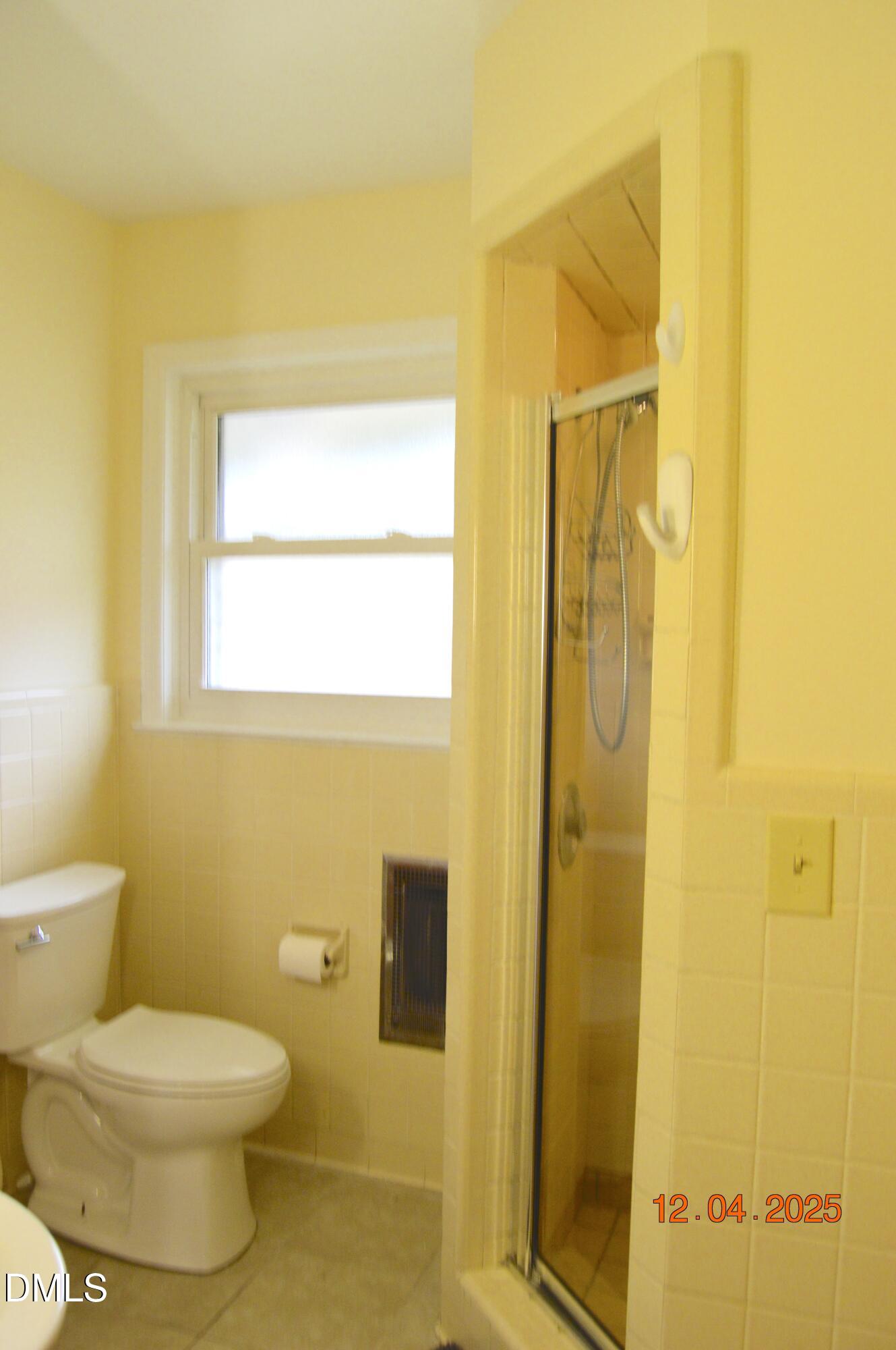 681 Polenta Road Smithfield, NC 27577 - Photo 13 of 34 a bathroom with a toilet and a shower