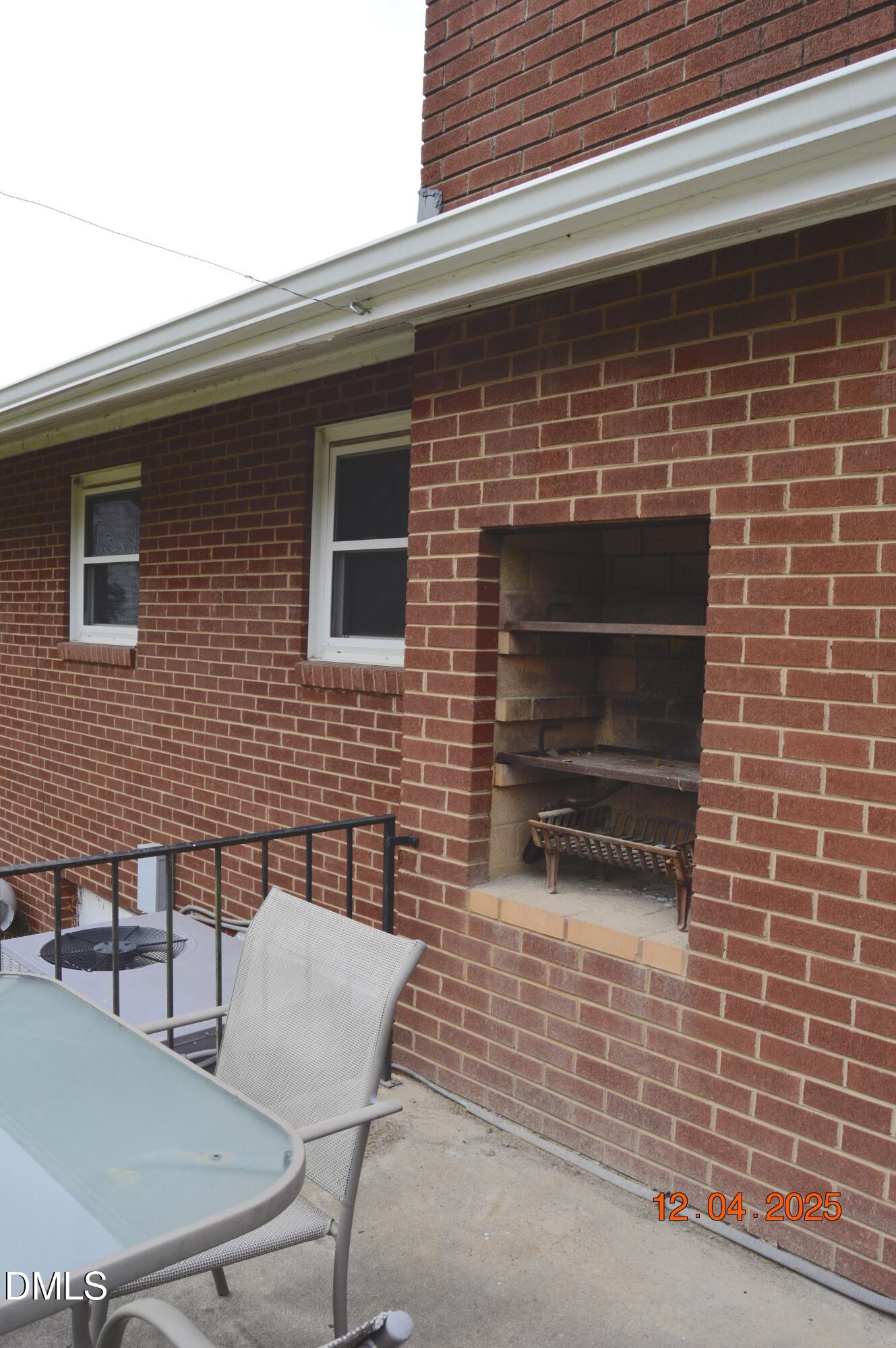 681 Polenta Road Smithfield, NC 27577 - Photo 26 of 34 a brick house with table and chairs