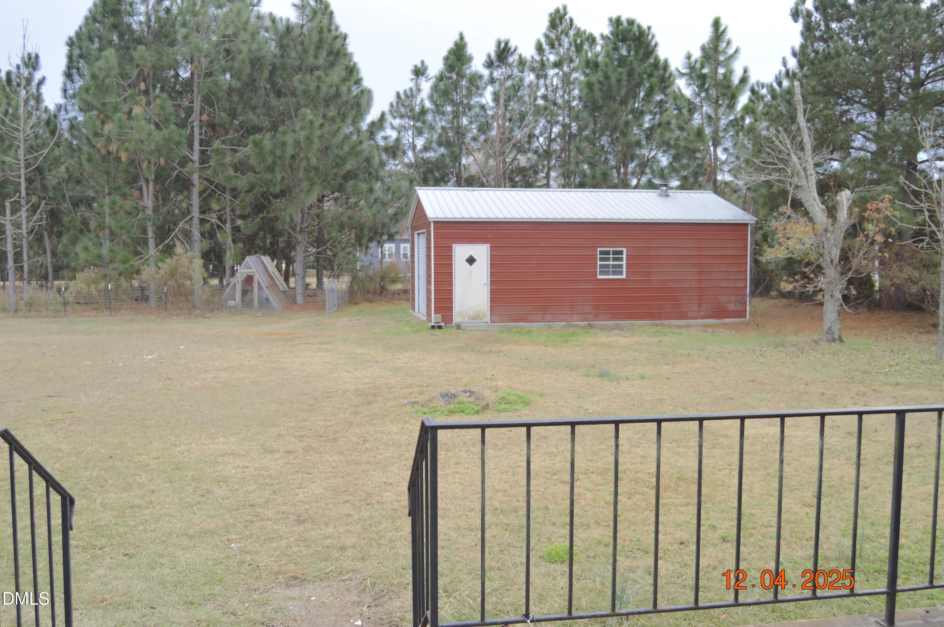 681 Polenta Road Smithfield, NC 27577 - Photo 27 of 34 a view of a brick wall and trees in the background