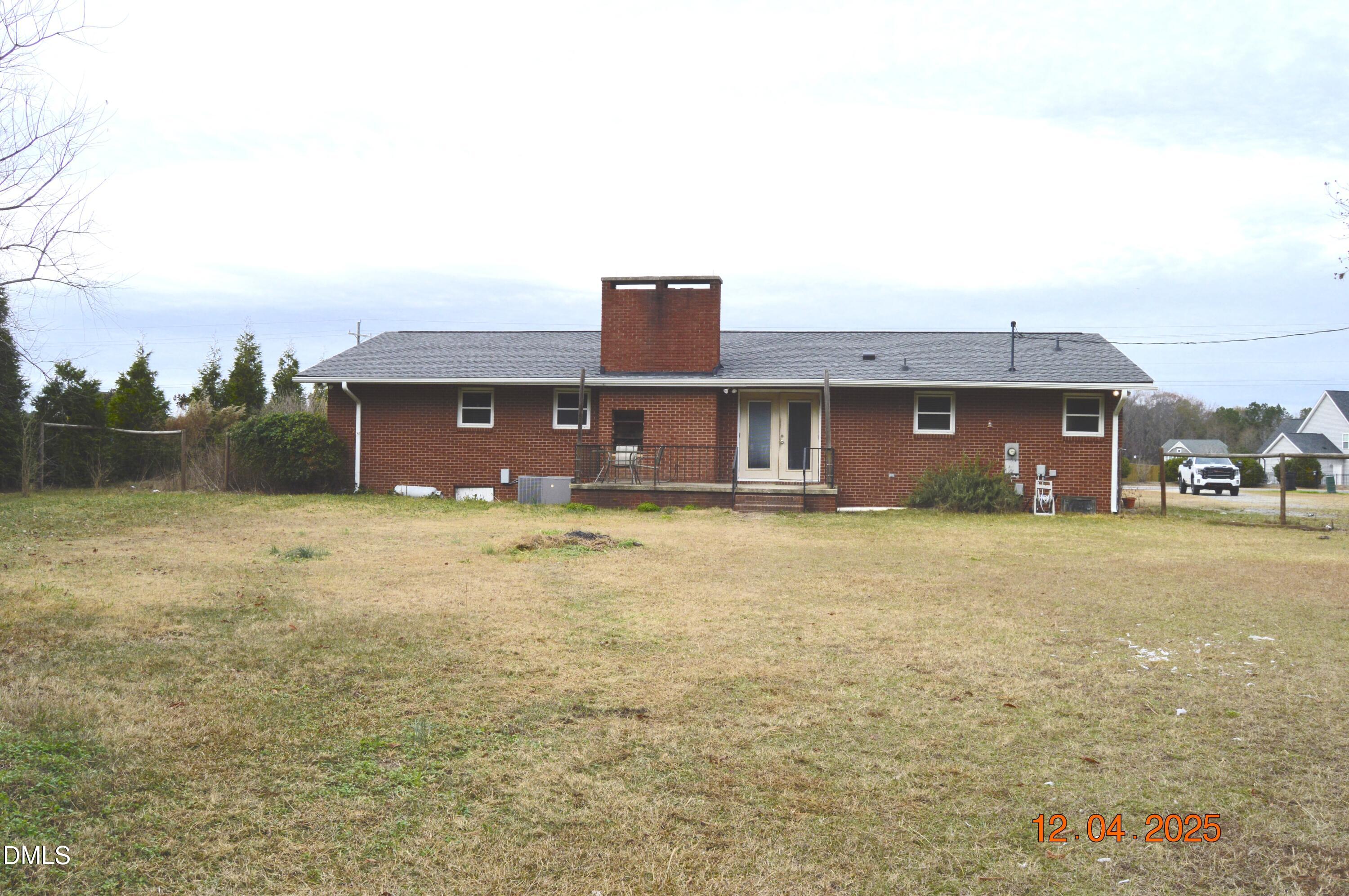 681 Polenta Road Smithfield, NC 27577 - Photo 30 of 34 a front view of a house with a yard and garage