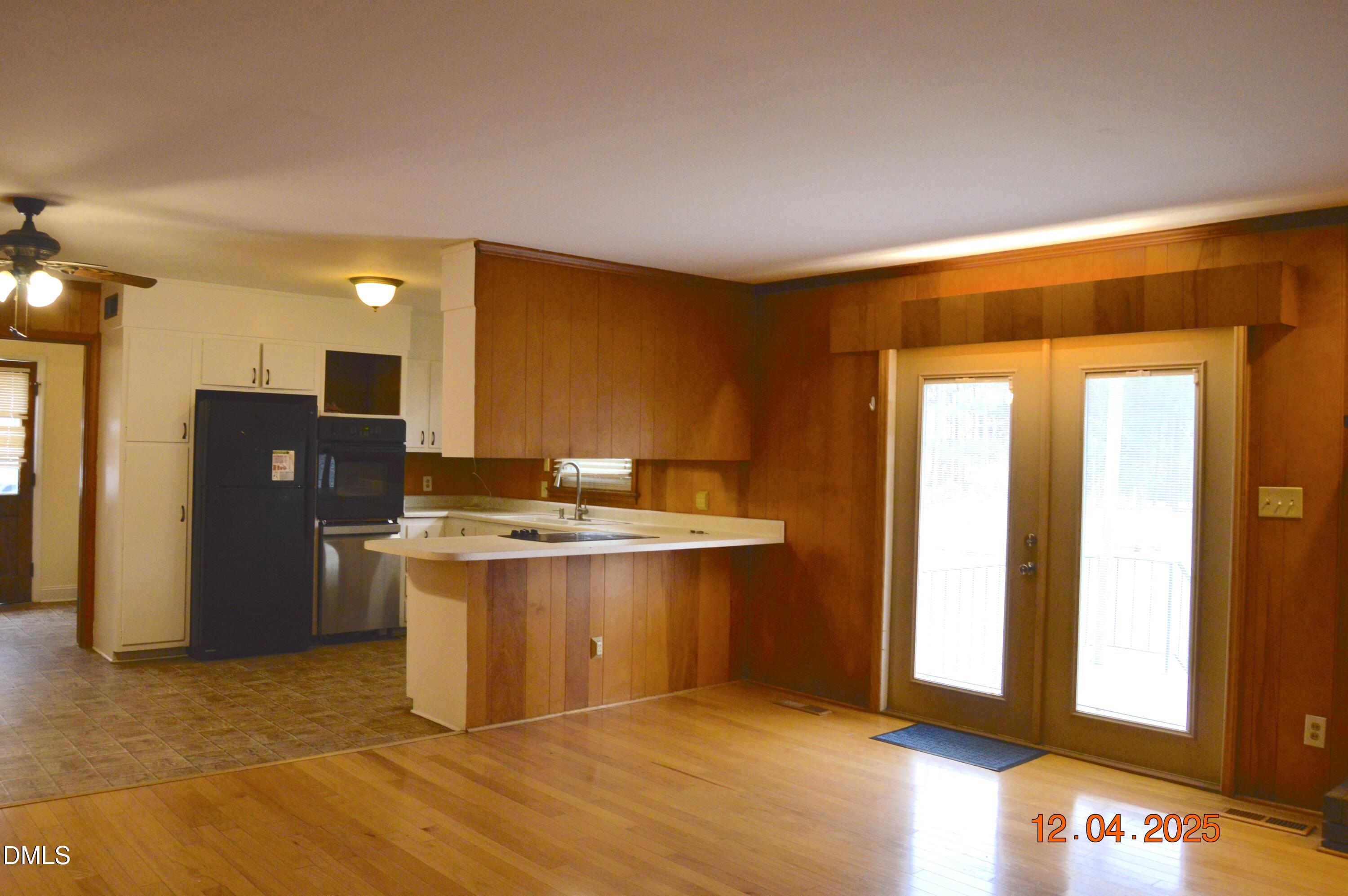 681 Polenta Road Smithfield, NC 27577 - Photo 5 of 34 a kitchen with a sink cabinets and stainless steel appliances
