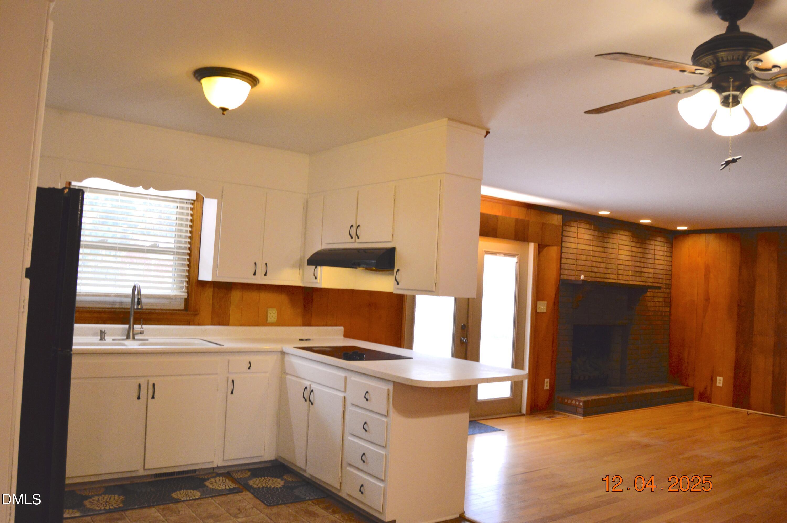681 Polenta Road Smithfield, NC 27577 - Photo 6 of 34 a kitchen with a sink cabinets and window