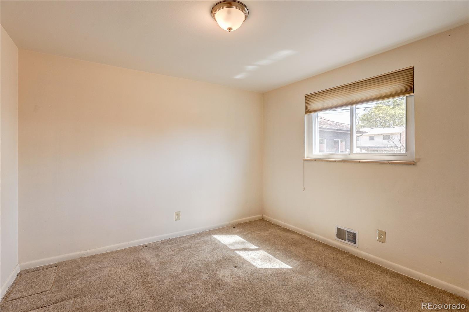 4570 Field Street Wheat Ridge, CO 80033 - Photo 16 of 44 an empty room with windows