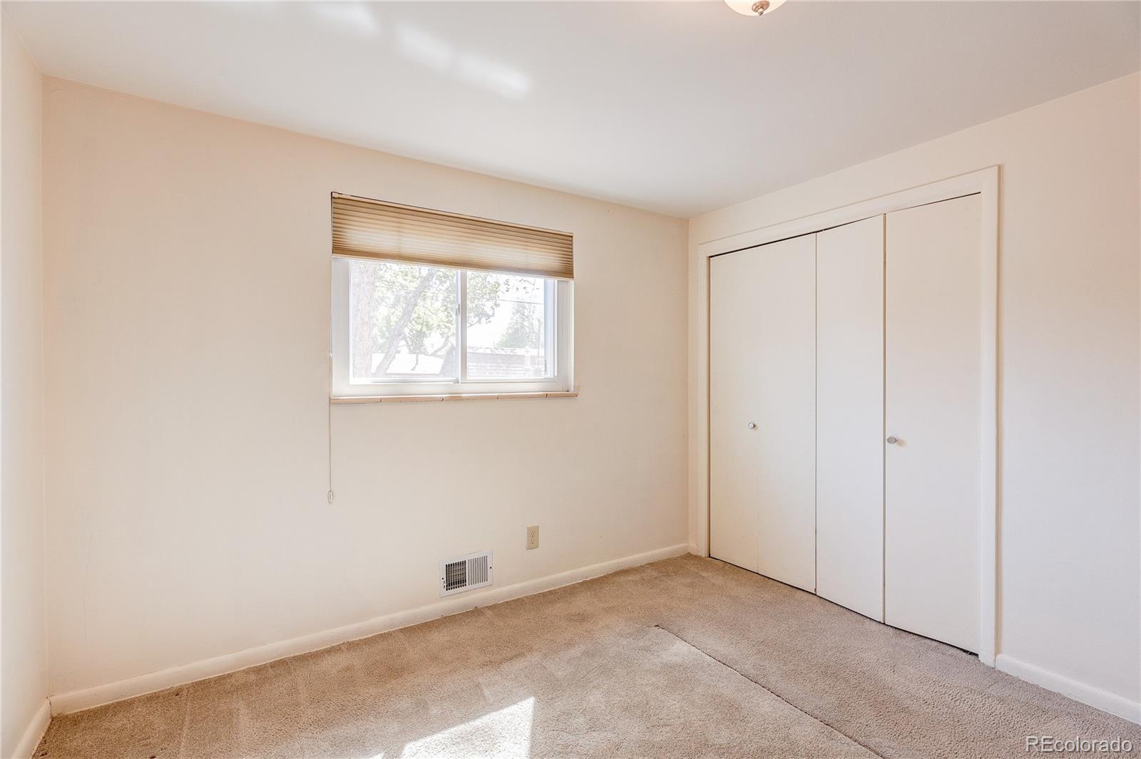 4570 Field Street Wheat Ridge, CO 80033 - Photo 17 of 44 a view of an empty room with a window