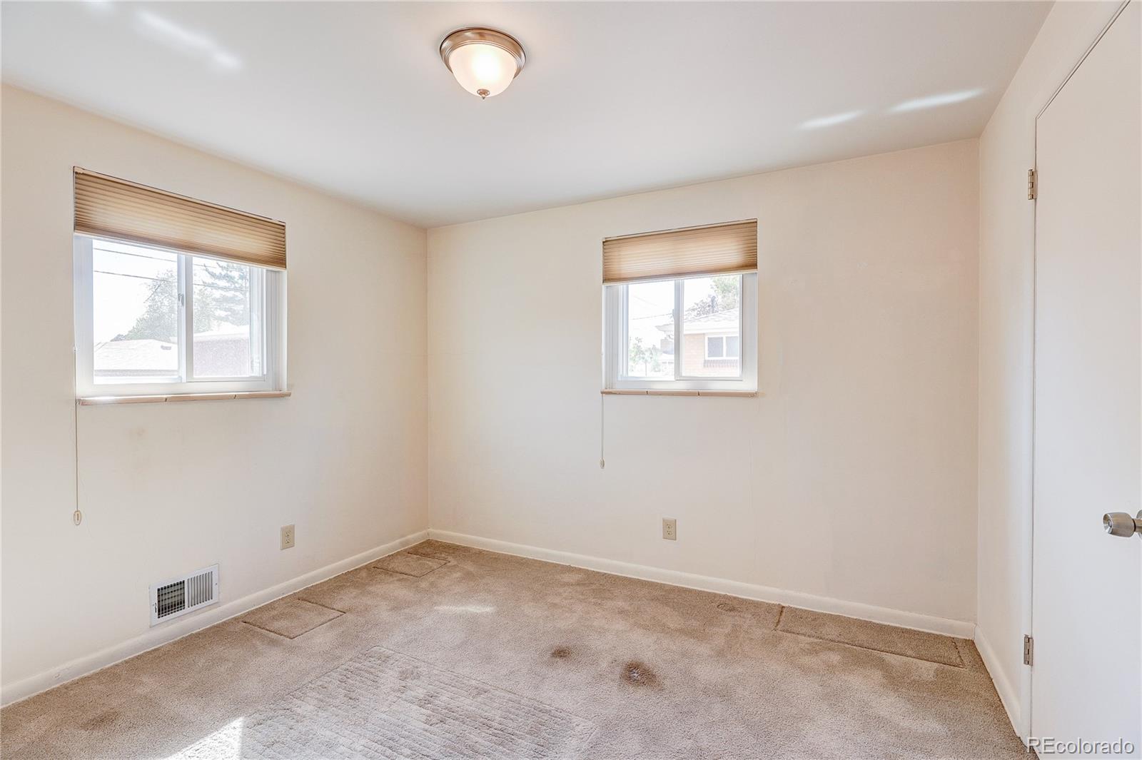 4570 Field Street Wheat Ridge, CO 80033 - Photo 19 of 44 an empty room with a window