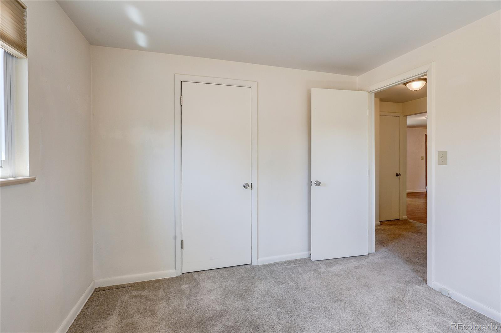 4570 Field Street Wheat Ridge, CO 80033 - Photo 20 of 44 an empty room with closet area