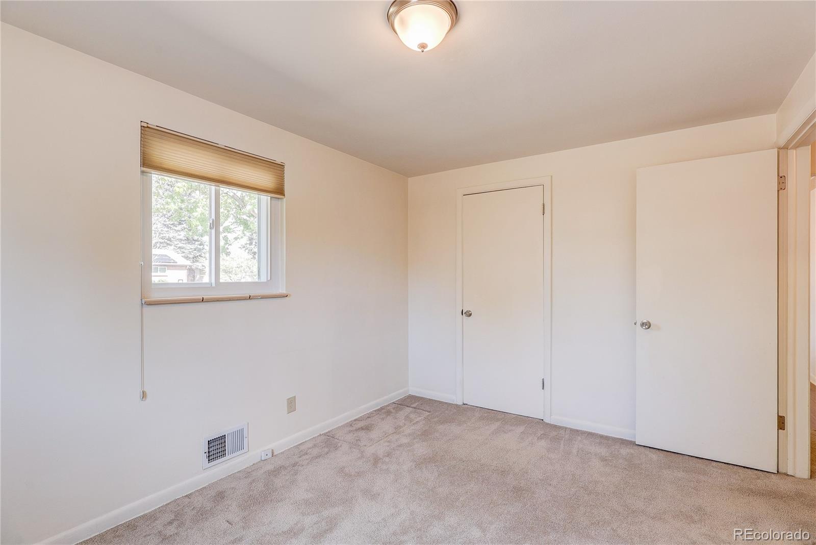 4570 Field Street Wheat Ridge, CO 80033 - Photo 22 of 44 a view of an empty room with a window